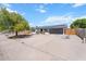 Beautiful home featuring a well-maintained lawn, modern design elements, and a spacious driveway at 1561 N Sterling St, Mesa, AZ 85207