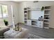 Cozy living room showcasing built-in shelving, soft decor, and ample storage space at 1561 N Sterling St, Mesa, AZ 85207