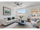 Cozy living room with a white sofa, large window, and modern decor at 1561 N Sterling St, Mesa, AZ 85207