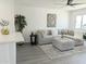 Comfortable living room with a sectional sofa, modern artwork, and neutral decor at 1561 N Sterling St, Mesa, AZ 85207