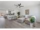 Open-concept living room and kitchen area with hardwood floors and neutral decor at 1561 N Sterling St, Mesa, AZ 85207