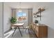 Bright home office with a modern desk, stylish shelves, and a comfortable chair at 1561 N Sterling St, Mesa, AZ 85207