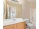 Bathroom featuring a large vanity and a shower at 16209 W Acapulco Cir, Surprise, AZ 85379