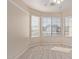 Bright room with neutral carpet, ceiling fan and windows at 16209 W Acapulco Cir, Surprise, AZ 85379