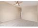 Large bedroom with neutral walls, a ceiling fan, and carpeted floors at 16209 W Acapulco Cir, Surprise, AZ 85379