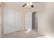 Bedroom with a ceiling fan, and a large closet with sliding doors at 16209 W Acapulco Cir, Surprise, AZ 85379