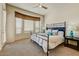 Tranquil bedroom with a comfortable bed, soft lighting, and ample natural light at 16420 N Thompson Peak Pkwy # 2101, Scottsdale, AZ 85260