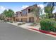 Inviting townhome complex showcases manicured landscaping and private garage entrances at 16420 N Thompson Peak Pkwy # 2101, Scottsdale, AZ 85260