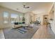 Open-concept living area with tile flooring, natural light, and a comfortable seating arrangement at 16420 N Thompson Peak Pkwy # 2101, Scottsdale, AZ 85260