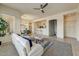 Spacious living room with a ceiling fan, comfortable seating, and a seamless flow to the kitchen at 16420 N Thompson Peak Pkwy # 2101, Scottsdale, AZ 85260