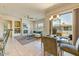 Bright living space featuring fireplace, tile flooring, and seamless indoor-outdoor flow at 16420 N Thompson Peak Pkwy # 2101, Scottsdale, AZ 85260