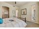Serene bedroom with soft carpet, a walk-in closet, and a private door to the exterior at 16420 N Thompson Peak Pkwy # 2101, Scottsdale, AZ 85260
