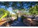 View of the neighborhood playground with a climbing structure, slides, a bridge and desert landscaping at 16420 N Thompson Peak Pkwy # 2101, Scottsdale, AZ 85260