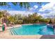 Community swimming pool with lounge chairs and patio area at 16420 N Thompson Peak Pkwy # 2101, Scottsdale, AZ 85260