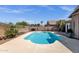 Backyard features a blue pool, drought-resistant landscaping, and privacy fencing at 17204 E Kensington Pl, Fountain Hills, AZ 85268