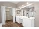 Bathroom featuring double sinks and open walk-in closet with tile flooring at 17204 E Kensington Pl, Fountain Hills, AZ 85268