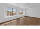 Bright bedroom features wood-look floors, ceiling fan, and large windows allowing for ample natural light at 17204 E Kensington Pl, Fountain Hills, AZ 85268