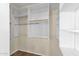Walk-in closet with multiple levels of shelving and hanging racks at 17204 E Kensington Pl, Fountain Hills, AZ 85268
