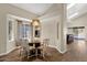 Charming dining area with a glass table, elegant chairs, and ample natural light, ideal for meals at 17204 E Kensington Pl, Fountain Hills, AZ 85268