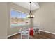 Cozy dining nook with desert view, light fixture and elegant furniture near a sparkling pool at 17204 E Kensington Pl, Fountain Hills, AZ 85268