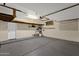 Spacious garage with epoxy flooring, overhead storage, and ample room for vehicles at 17204 E Kensington Pl, Fountain Hills, AZ 85268