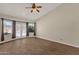 Living room featuring tile floors, ceiling fan and views of the pool at 17204 E Kensington Pl, Fountain Hills, AZ 85268