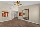 Spacious living room with tile flooring, ceiling fan, and artwork at 17204 E Kensington Pl, Fountain Hills, AZ 85268