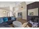 Expansive living room with high ceilings, a staircase, and stylish furnishings, creating an airy atmosphere at 17204 E Kensington Pl, Fountain Hills, AZ 85268