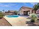 Pool in a backyard with drought-tolerant landscaping and mature trees at 17204 E Kensington Pl, Fountain Hills, AZ 85268