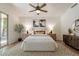 Bedroom with ceiling fan, sliding doors to outside and wooden decor at 1807 W Canary Way, Chandler, AZ 85286