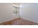 Sunlit bedroom with unique tile floors, large window view and ample natural light at 1807 W Canary Way, Chandler, AZ 85286