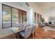Bright dining area with natural light, dining table, and cozy seating, seamlessly flowing into the living space at 1807 W Canary Way, Chandler, AZ 85286