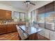 Warm dining room with wood table, four chairs, and views from the windows at 1807 W Canary Way, Chandler, AZ 85286