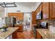 Open kitchen featuring granite counters, stainless appliances, with view to the living room and dining area at 1807 W Canary Way, Chandler, AZ 85286