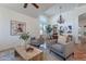 Bright and airy living room with comfortable seating, high ceilings, and elegant chandelier at 1807 W Canary Way, Chandler, AZ 85286