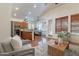 Open-concept living room seamlessly connected to the modern kitchen and dining area, bathed in natural light at 1807 W Canary Way, Chandler, AZ 85286