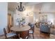 Open-concept living space with tile floors, stylish furnishings, and abundant natural light at 1807 W Canary Way, Chandler, AZ 85286