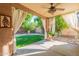 Relax on the covered patio and enjoy the beautiful backyard view and fountain feature at 1807 W Canary Way, Chandler, AZ 85286