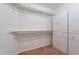 Spacious walk-in closet features built-in shelving and cabinets, perfect for organized storage at 1807 W Canary Way, Chandler, AZ 85286