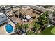 Charming home with a pool, lush landscaping, and a cozy backyard entertainment area at 1953 E Presidio Rd, Phoenix, AZ 85022