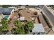 Overhead view of property showing desert landscaping, mature trees, and nearby pool at 1953 E Presidio Rd, Phoenix, AZ 85022