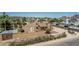 Aerial view of the property showcasing desert landscaping, mature trees, and mountain views at 1953 E Presidio Rd, Phoenix, AZ 85022