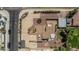 Expansive aerial view of a property featuring a well-maintained yard, multiple structures, and desert landscaping at 1953 E Presidio Rd, Phoenix, AZ 85022