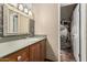 Stylish bathroom with a modern sink, wooden cabinetry, mosaic tile accents, and unique design elements at 1953 E Presidio Rd, Phoenix, AZ 85022