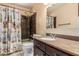 Bathroom features a shower-tub combo and vanity sink at 1953 E Presidio Rd, Phoenix, AZ 85022