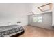 Spacious bedroom with a ceiling fan, wood floors, and a window with mountain views at 1953 E Presidio Rd, Phoenix, AZ 85022