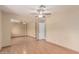Bedroom features ceiling fan, wood look floors and mirrored closet at 1953 E Presidio Rd, Phoenix, AZ 85022