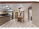 Open dining area features a wooden table and chairs, tile floors, and ample natural light at 1953 E Presidio Rd, Phoenix, AZ 85022