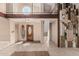 Open foyer featuring tile flooring, a staircase, and a unique front door at 1953 E Presidio Rd, Phoenix, AZ 85022