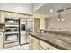 This kitchen features stainless steel appliances, stone countertop, and decorative cabinets at 1953 E Presidio Rd, Phoenix, AZ 85022